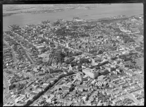 Auckland City with Karangahape Road, Nelson and Queen Streets, Albert Park, railway yards, the dock area and harbour