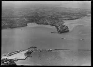 Construction of the Auckland Harbour Bridge at Westhaven Marina with Northcote Peninsula and Little Shoal Bay beyond, Auckland City