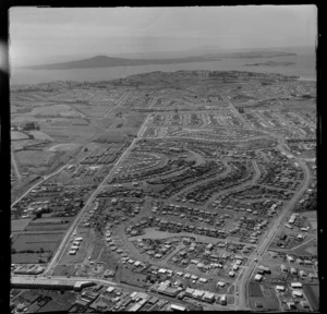 Panmure with the Ellerslie-Panmure Highway and Pilkington Road, with residential and industrial buildings, with Auckland Harbour beyond