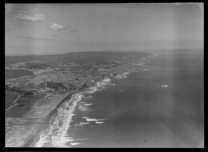 Muriwai Beach with pine plantation and coastal settlement, looking south to farmland beyond, Auckland Region