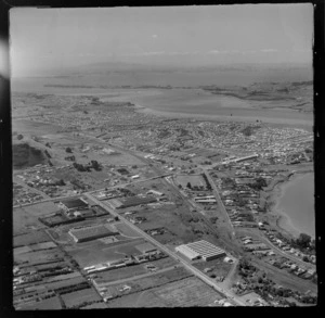 Panmure industrial area with the Mount Wellington and Ellerslie- Panmure Highways, with Bucklands Beach and harbour beyond, Auckland City