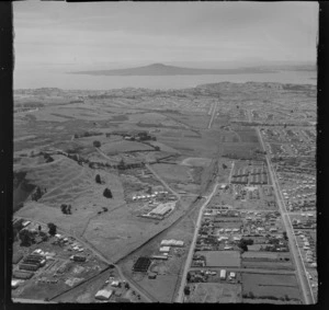 Panmure industrial area with Jellicoe and Pilkington Roads, railway line and Mount Wellington Domain, with the Auckland Harbour beyond