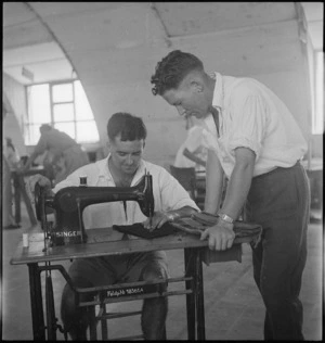 J Findlay sews and D J Henderson looks on in the Occupational Therapy Wing at 2 NZGH Kantara, Egypt - Photograph taken by George Kaye