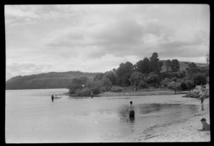 Unidentified people fly fishing at the junction of the Ohau Channel with Lake Rotorua, Bay of Plenty Region