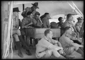 Group watching cricket match between the NZ and South African Artillery teams at Maadi, Egypt - Photograph taken by George Kaye