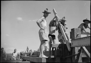 NZ engineers rebuilding pontoon bridge across Suez Canal, World War II - Photograph taken by George Kaye