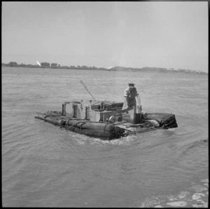 NZ Engineers' experimental amphibious bren carrier taking ground coming ashore from the Nile at Maadi, Egypt - Photograph taken by George Bull