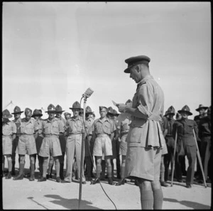 Brigadier H S Kenrick speaking at the handing over of cheque donated by repatriated POWs at 23rd NZ Field Ambulance Unit, Maadi - Photograph taken by G Bull