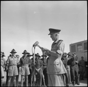 Major Tweedie, NZ Representative of the Red Cross Society, responds after receiving a cheque donated by repatriated NZ POWs, Maadi, Egypt - Photograph taken by G Bull