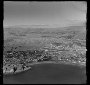Titahi Bay coastal settlement with headland and Bay Drive road in foreground, looking to Paremata and Pauatahanui Inlet beyond, Wellington Region