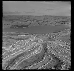 Titahi Bay residential housing and Main Road with Kura Park running to Porirua Harbour beyond, Wellington Region