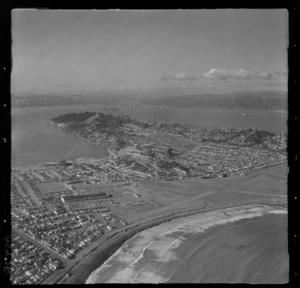 The Wellington City eastern suburbs of Kilbirnie with Lyall Bay and Rongotai with Wellington Airport in foreground to Miramar Peninsula and Wellington Harbour beyond