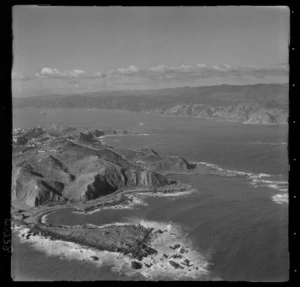 Palmer Head and the entrance to Wellington Harbour with Tarakena Bay and Moa Point Road, with Miramar Peninsula and Breaker Bay beyond, Wellington City