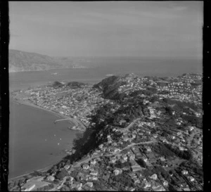 Wellington City eastern suburb of Seatoun on the Miramar Peninsula, with Worser Bay and jetty with Marine Parade road and Wellington Harbour entrance beyond