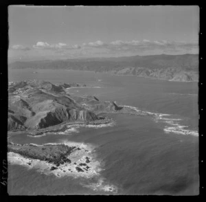 Palmer Head and the entrance to Wellington Harbour with Tarakena Bay and Moa Point Road, with Miramar Peninsula and Breaker Bay beyond, Wellington City