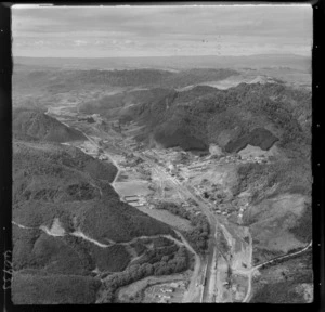 Mangapehi, Taranaki, includes township, railway lines, industrial buildings, roads, sports grounds, bush and housing