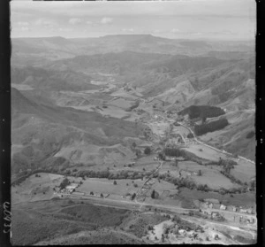 Ongarue, Manawatu, includes farmland, roads, buildings, railway lines, bush and housing