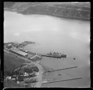 Patent Slip with vessels on dry land in foreground, and wharf area with steam ship on Evans Bay Parade road, Hataitai, Wellington City