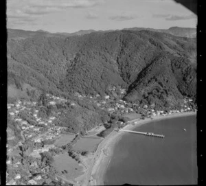 Days Bay with Marine Drive road, wharf and Wellington Harbour, Days Bay Pavilion and gardens, tennis courts and Wellesley College, Eastbourne, Wellington Region