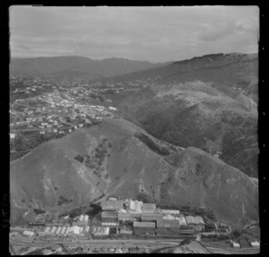 [Wellington Meat Export Company?] at the junction of Hutt Road and Ngauranga Gorge with the suburb of Khandallah beyond, Wellington City