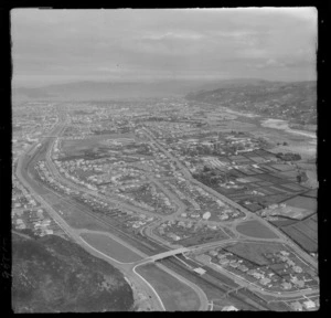 The suburb of Naenae with Wingate Station and Bridge in foreground with High Street and Naenae College, looking south to Lower Hutt, Wellington Region