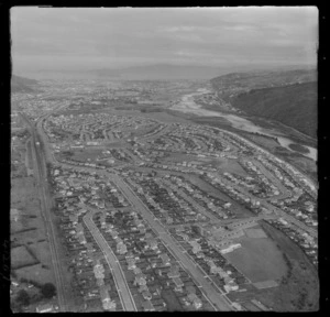 The suburb of Taita with High Street and Pomare Primary School in foreground with the Hutt River, looking south to Lower Hutt City , Wellington Region