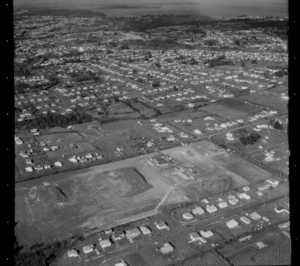 The suburb of Kelston with an unidentified [school?] under construction, Auckland City