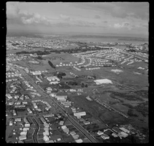 Stoddard Road with bus depot and lumberyard, with Winstone Park and Manukau Harbour beyond, Onehunga, Auckland