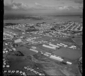 Mount Roskill Grammar College with sports fields, looking to the Manukau Harbour beyond, Onehunga, Auckland