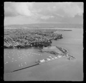 Point Erin Park and Westhaven Marina with the construction of the Auckland Harbour Bridge, Point Chevalier beyond, Auckland City