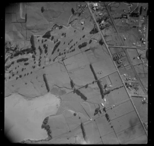 The Great South Road through farmland with Manuroa Road junction and Pahurehure Inlet, Takanini, South Auckland