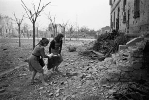 Women of the village of Sesto Imolese, Italy, searching amongst rubble for personal belongings - Photograph taken by George Kaye