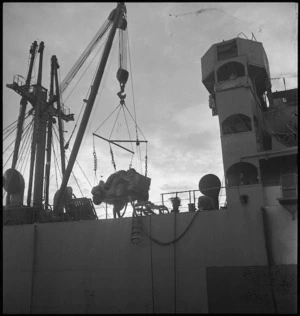 Light armoured vehicle being unloaded from the transport at Bari, Italy, World War II - Photograph taken by George Kaye