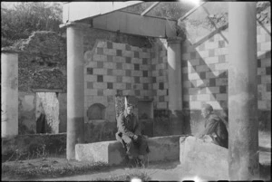 Two New Zealand soldiers rest outside ancient house in Pompei, Italy, World War II - Photograph taken by George Kaye