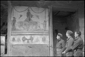 New Zealand soldiers looking at a mural in Pompei, Italy, World War II - Photograph taken by George Kaye