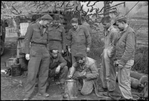 New Zealanders on 5th Army Front, World War II, watch an American soldier welding, southern Italy - Photograph taken by George Kaye