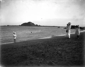 Unidentified woman and children on the beach at Island Bay, Wellington