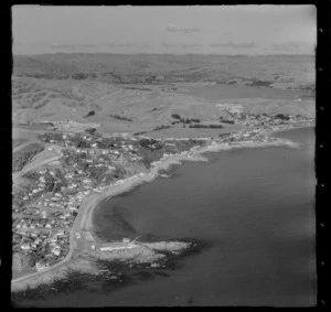 Karehana Bay and Plimmerton Boating Club with Moana Road foreground, looking south to Plimmerton coastal village and Pauatahanui Inlet beyond, Wellington Region