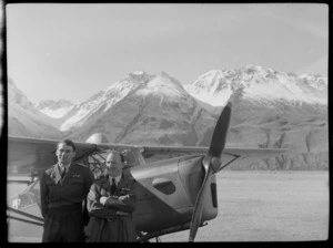 Mount Cook Air Services Ltd, Auster aircraft and two unidentified men during the preparation for the Antarctic Expedition, Mount Cook Airfield, Mount Cook National Park, Canterbury Region