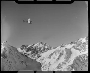 Mount Cook Air Services Auster ZK-BLZ Ski Plane over the Tasman Glacier with snow covered mountains beyond, Mount Cook National Park, Canterbury Region