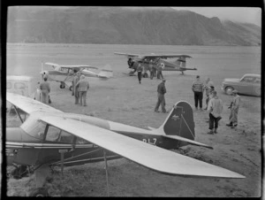 Mount Cook Airfield with Mount Cook Air Services Auster ZK-BLZ and Piper Tripacer Ski Planes and Sir Edmund Hillary's Antarctic Beaver NZ6001 Ski Plane with unidentified men, Mount Cook National Park, Canterbury Region