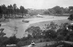 View in Milford, Auckland, with a water-way and boat