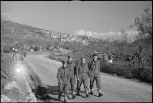 Soldiers walking on road near small Italian village of San Pietro, World War II - Photograph taken by George Kaye