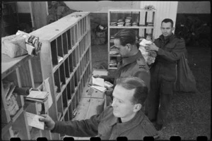 Sorting mail at NZ MPO in Bari, Italy, World War II - Photograph taken by George Bull
