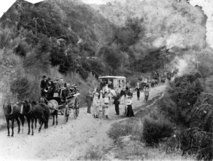 Procession of carriages, passengers and cyclists