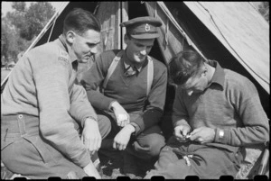 Men at the NZ LOB Camp pass the time carving chess pieces, Italy, World War II - Photograph taken by George Bull