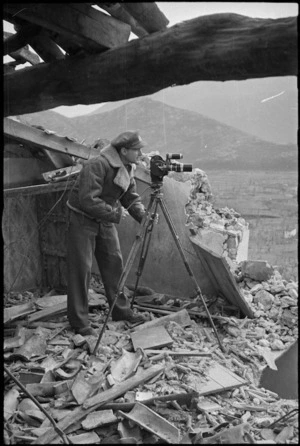 Photographer M D Elias at work in the Monte Cassino area, Italy, World War II - Photograph taken by George Kaye