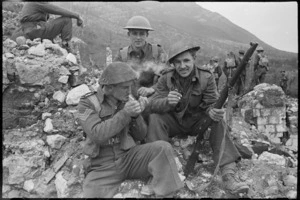New Zealanders enjoy a quiet smoke during spell in fighting in Monte Cassino, Italy, World War II - Photograph taken by George Kaye