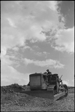 Bulldozer at work in the forward areas of the Monte Cassino Front, Italy, World War II - Photograph taken by George Kaye