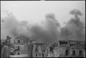 Smoke from the raid on Cassino rising behind the ruins of Cevaro, Italy, World War II - Photograph taken by George Kaye